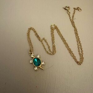 Elegant Gold Necklace with Green Gemstone Turtle
